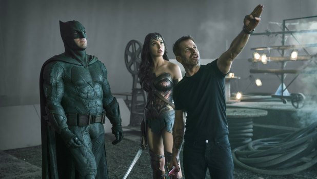 Snyder, right, with Ben Affleck as Batman and Gal Gadot as Wonder Woman on set. 