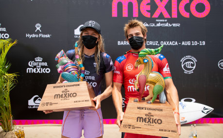 Stephanie Gilmore and Jack Robinson celebrate after winning the Corona Open in Mexico.