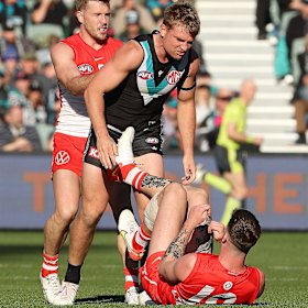 Ollie Wines and Peter Ladhams tangle in June 2022.