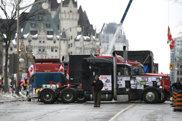 Trucks block the road outside the Chateau Laurier in Ottawa, Canada, as protesters plan similar anti-COVID restriction blockades in Paris, Brussels and beyond.