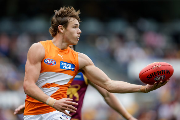Aaron Cadman shows the Sherrin to his Lions opponents.