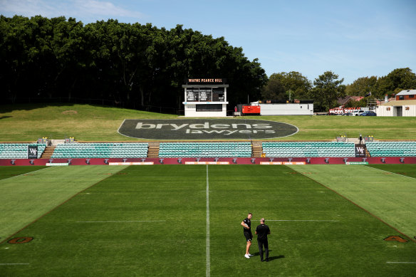 Adam Doueihi chats with good friend and former coach Michael Maguire.
