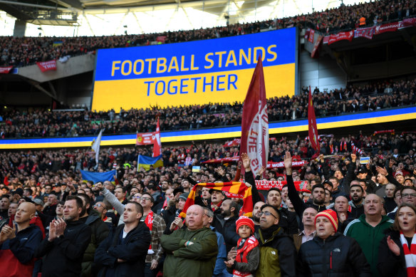 Liverpool fans hold banners in support of Ukraine ahead of the League Cup final against Chelsea at Wembley.