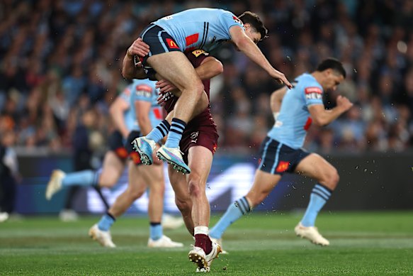 Harry Grant tackles Mitch Moses midair to give the Blues a penalty. 