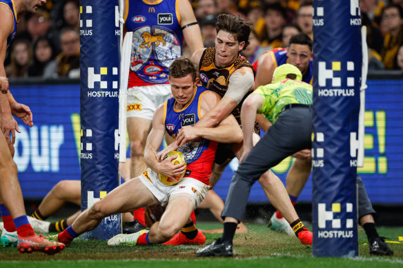 Will Day tackles the Lions’ Ryan Lester in their recent clash, won by Hawthorn.