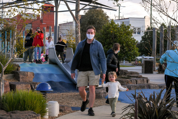 Kent Whalley and his son Heath at a busy Booran Reserve in Glen Huntly on Monday.