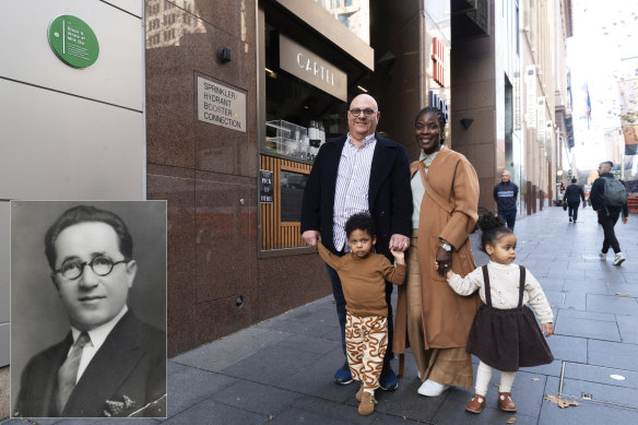Founder of Black & White 4D Milk Bar Mick Adams’ grandson Adam Gerondis with wife Gifty Gerondis, son Kirabo and daughter Adaku in front of the plaque. Inset is a portrait of Mick Adams from the 1920s.