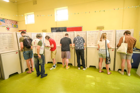 Voters at a polling booth at Fitzroy North Primary School.