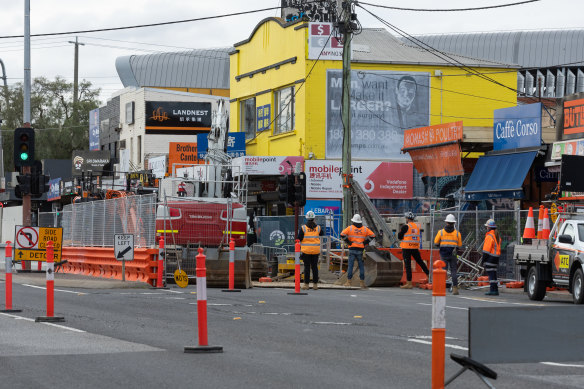 Workers in Clayton doing preparatory work for the Suburban Rail Loop this week.