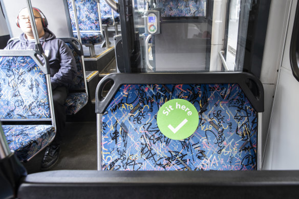 Stickers will indicate where people should sit on buses. 