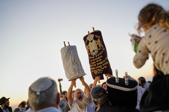 Israeli settlers celebrate the inauguration of a newly built synagogue at the occupied West Bank outpost of Homesh on September 16. The occupation is illegal under international law.