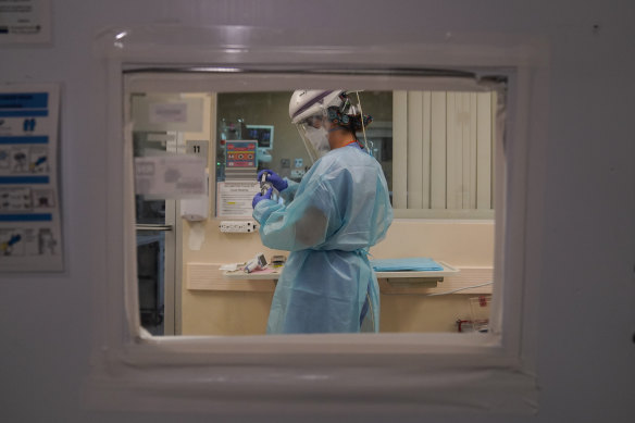 A nurse works in a COVID-19 unit at Mission Hospital in California. 