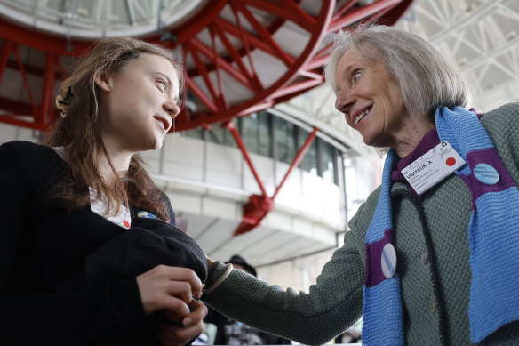 Swiss member of Senior Women for Climate Rosmarie Wydler-Walti, right, talks to Swedish climate activist Greta Thunberg after the European Court of Human Rights’ ruling.
