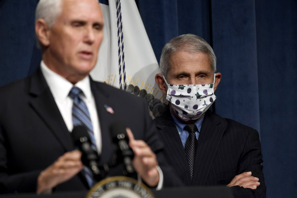 Vice President Mike Pence, left, and infectious disease expert Dr Anthony Fauci held their first briefing in nearly two months on Friday.