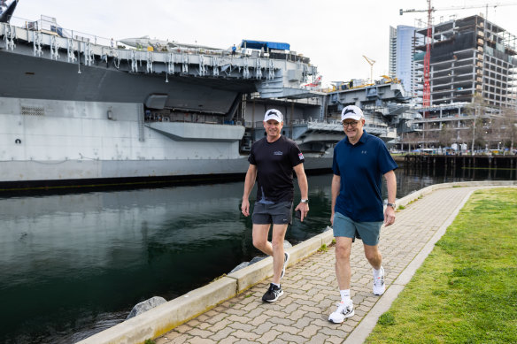 Australian Chief of Navy Vice Admiral Mark Hammond and Prime Minister Anthony Albanese in San Diego with the USS Midway Museum in the background.