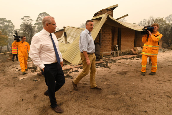 Prime Minister Scott Morrison and MP Darren Chester visit a farm in Sarsfield, Victoria.