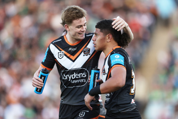 Lachlan Galvin (left) celebrates Luke Laulilii’s try on debut against Canberra.