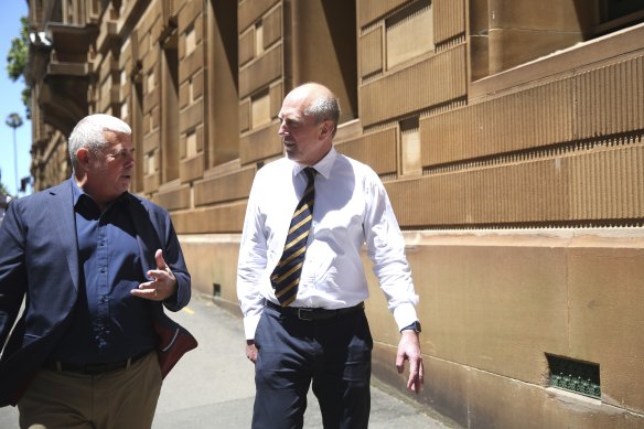 Bruce Grant (left) and Dr Gary Cox, both former co-conveners of the Gay and Lesbian Rights Lobby, leave the inquiry on Wednesday.
