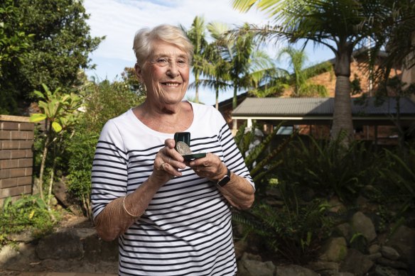 Sandra Morgan with the gold medal she won at the 1956 Games in Melbourne.