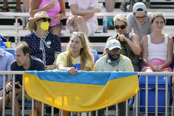 Fans display the Ukrainian flag at the Miami Open in March.