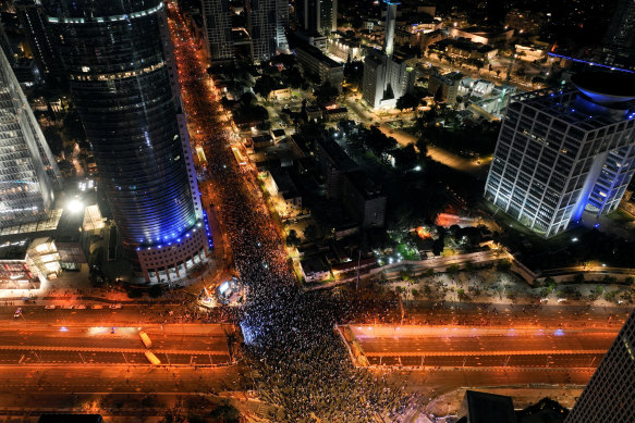 Israelis protest against Prime Minister Benjamin Netanyahu’s new right-wing coalition and its proposed judicial reforms to reduce powers of the Supreme Court, in Tel Aviv, Israel, on Saturday.