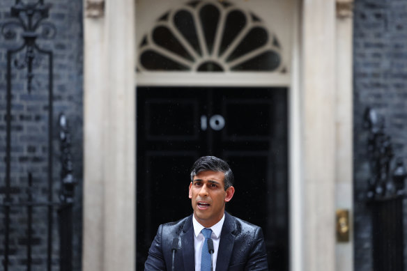 Standing in the rain, British Prime Minister Rishi Sunak announces the date for the UK election.