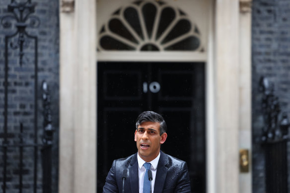 British Prime Minister Rishi Sunak in the rain. 