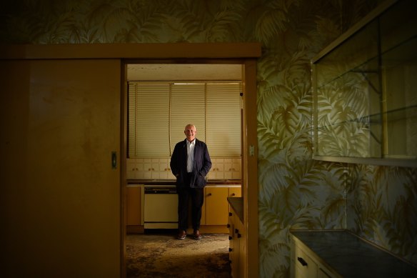 Nick Whitlam the son of former Australian Prime Minister Gough Whitlam inside the kitchen of his family home, with his parents’ alcohol cabinet to the right. 