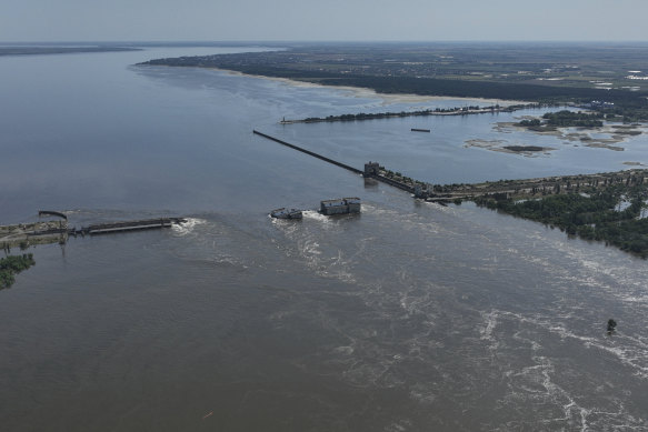 Water flows over the collapsed Kakhovka Dam in Nova Kakhovka, in Russian-occupied Ukraine.
