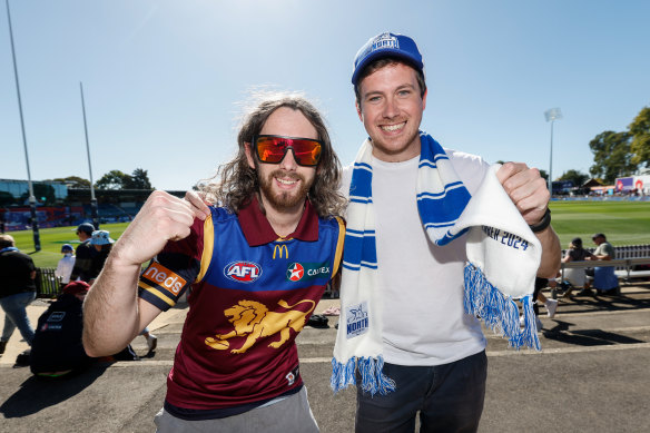 A Lions and a Roos fan enjoy the game.