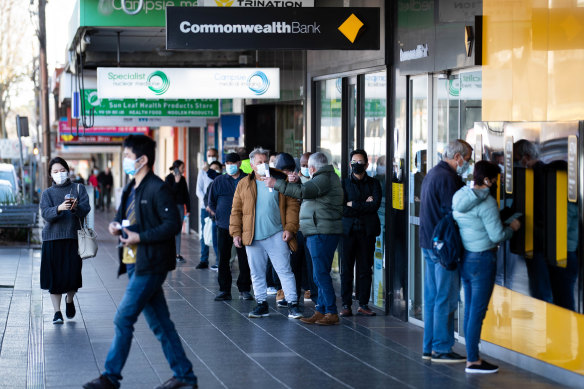 People line up outside the Commonealth bank in Campsie, a growing COVID-19 hotspot in the Bankstown Canterbury LGA.