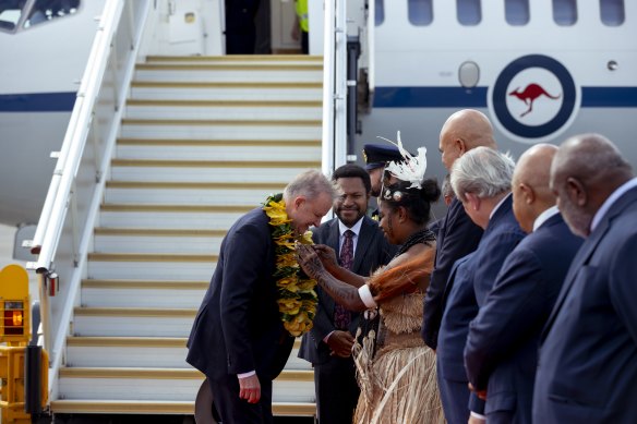 The prime minister is greeted at the airport.