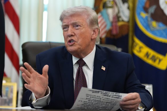 US President Donald Trump taking questions from reporters in the Oval Office on Tuesday.
