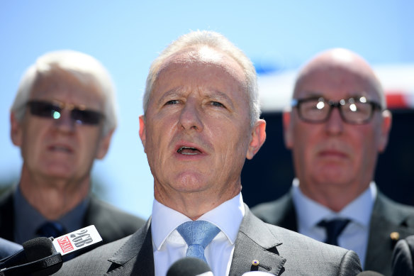 Former NSW Fire and Rescue Commissioner Greg Mullins (centre).