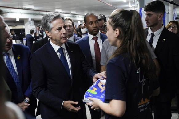 US Secretary of State Antony Blinken speaks to a dual US-Israeli citizen, as he visits a donation centre for victims of the Hamas terror attacks.