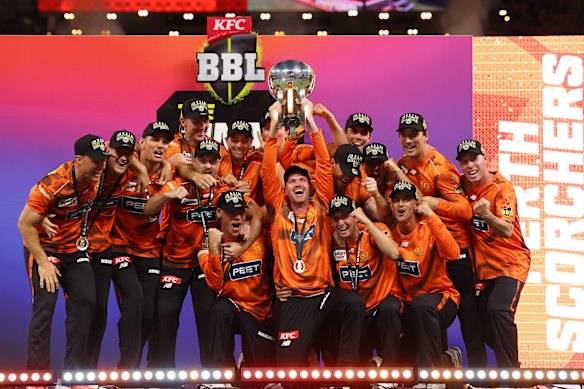 The Scorchers lift the BBL trophy.