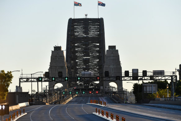 A fairly empty Sydney Harbour Bridge is seen on Sunday June 27, the city’s first day of lockdown.