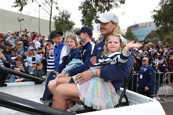 Smith on babysitting duty during the parade.