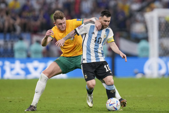 Harry Souttar tangles with Lionel Messi during the Socceroos’ round-of-16 loss to eventual champions Argentina in Qatar.