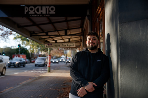 Manny Bustamante runs his family cafe on Botany Road but does not think it would benefit from more housing nearby.