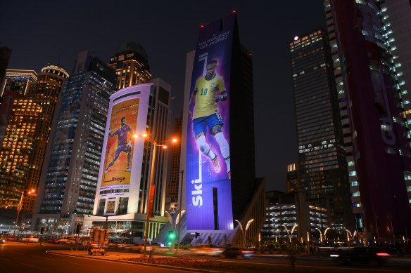 Skyscraper billboards featuring football superstars like Neymar are everywhere in Doha.