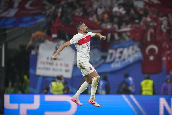 Turkey’s unlikely two-goal hero Merih Demiral celebrates his second against Austria.