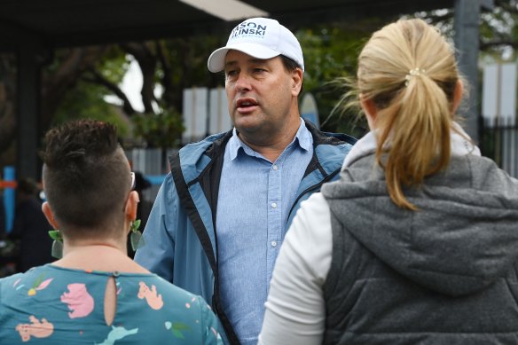Then-member for Mackellar Jason Falinski talks to voters in the electorate at the federal election in May last year.