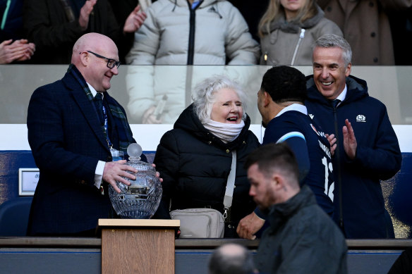 Sione Tuipulotu is presented with the Hopetoun Cup at Murrayfield by his grandmother Jaqueline Thomson.