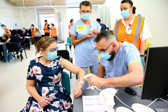 NSW front line health workers getting the COVID-19 vaccine earlier this year.