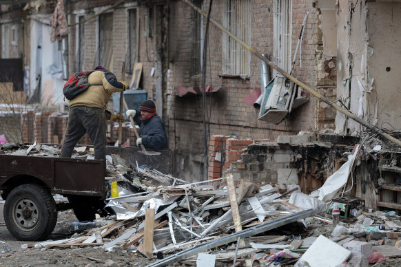 Workmen continue the clear up around buildings damaged by last week’s missile attack on December 5, in Vyshhorod, Ukraine.