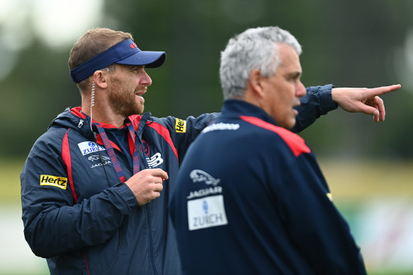 Melbourne coach Simon Goodwin and assistant Mark Williams at training at Casey Fields on Monday.