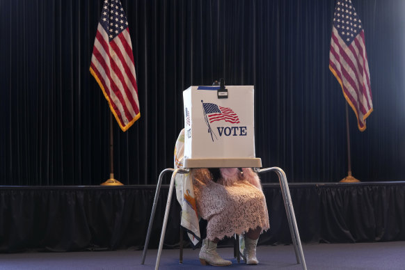 A voter works on her ballot at a polling place at the Ronald Reagan Presidential Library, Simi Valley, California.