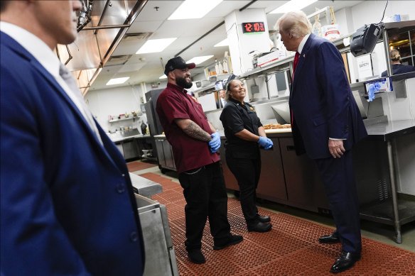 Trump talks with workers at ll Toro E La Capra restaurant in Las Vegas.