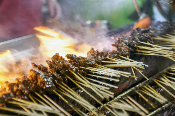 Fire and smoke at the night markets in Singapore’s Satay Street